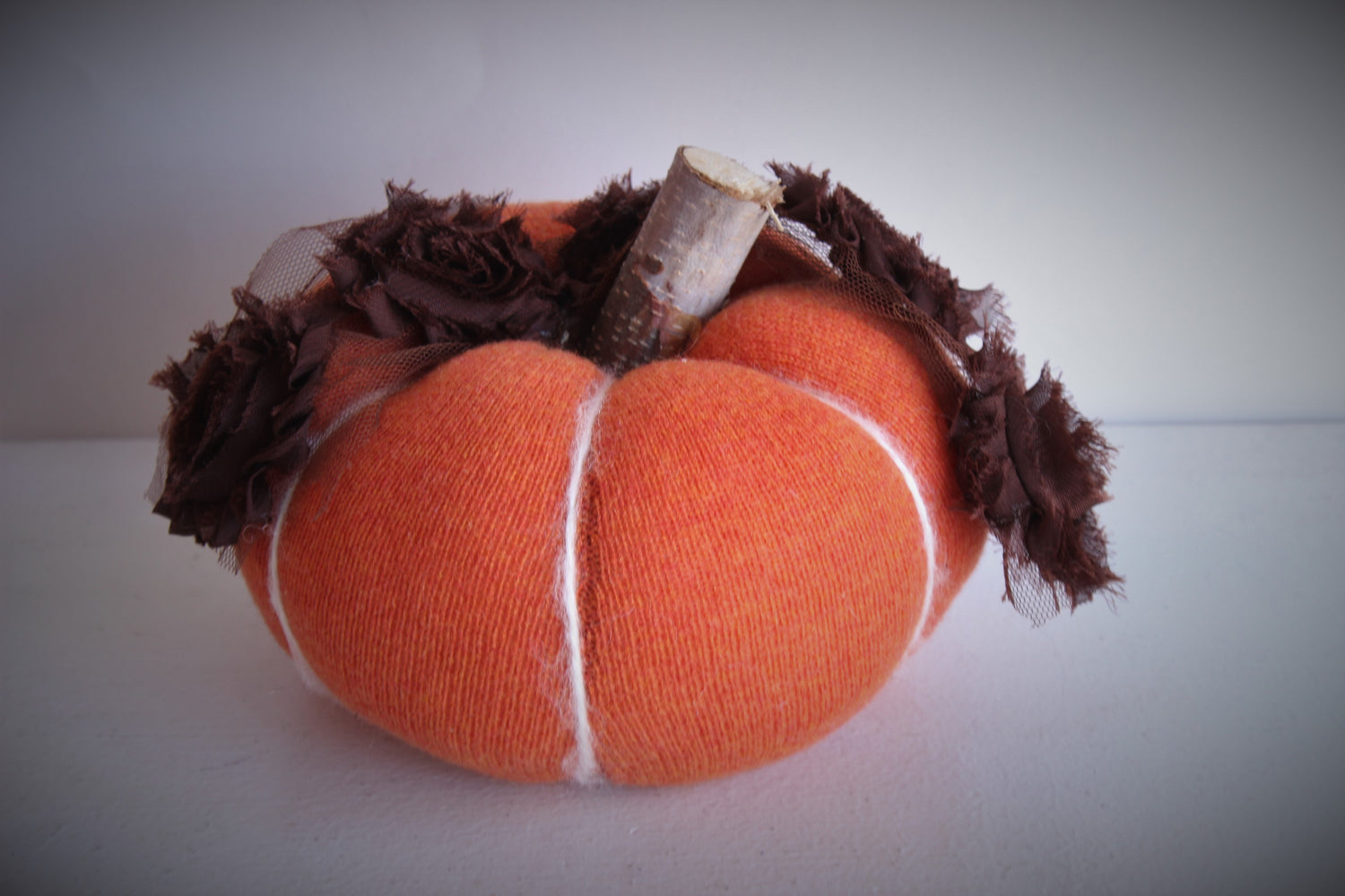 Jack O Lantern Knit Pumpkin Pillow Pouf With Tattered Rose Trim and Wooden Stem